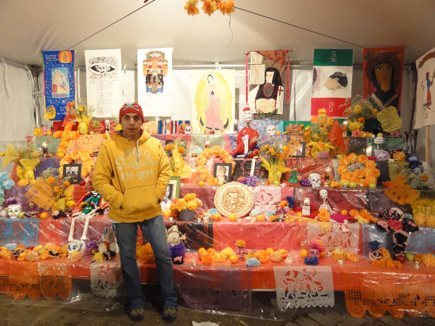 A man in front of a colorful display