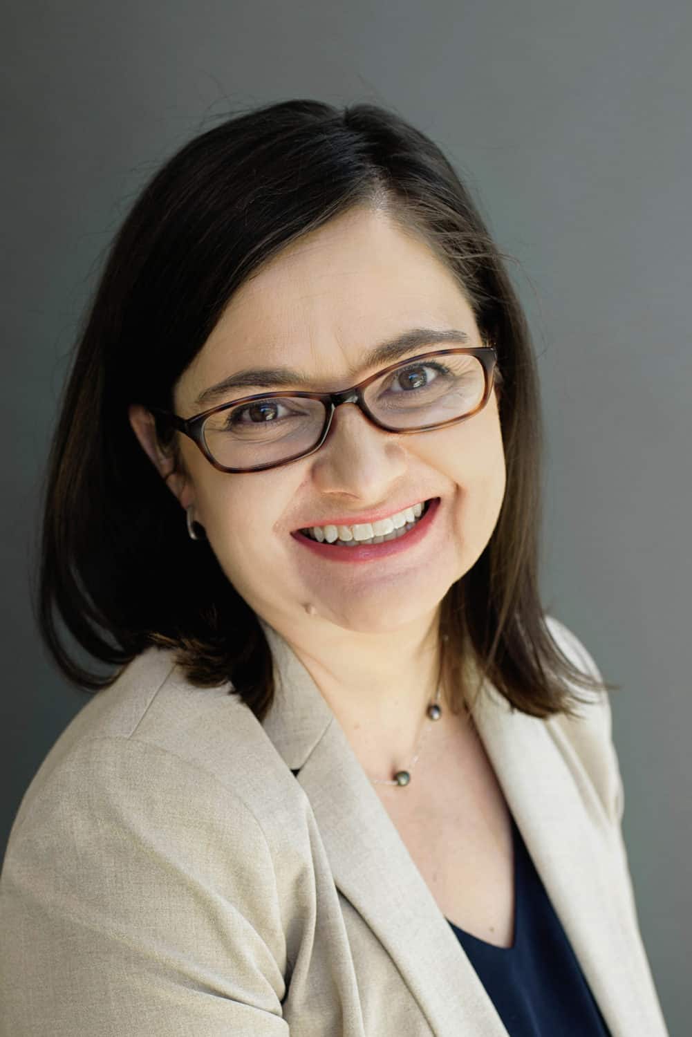 A headshot of a woman smiling at the camera.