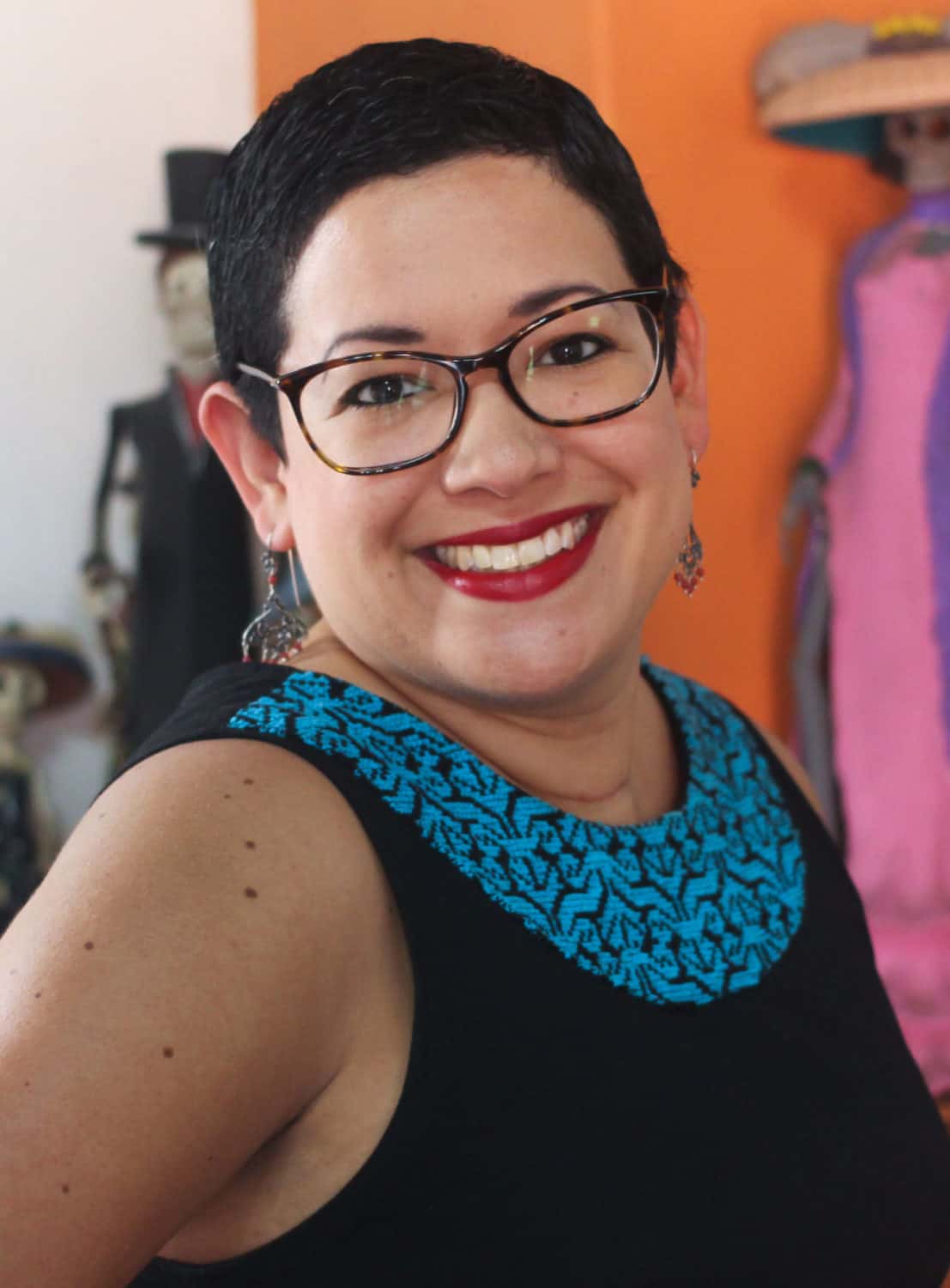 Headshot of a woman smiling at the camera.
