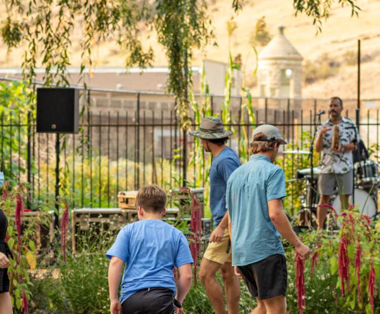 A group of people dancing as a band plays in the background.