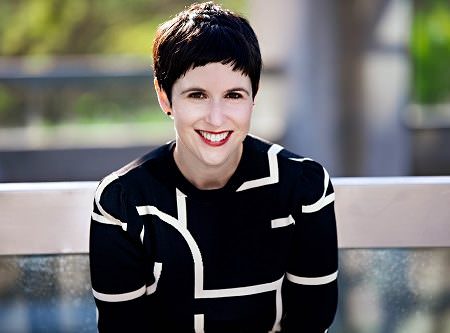 a portrait of a woman with short brown hair