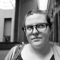 black and white photo of molly mcbride, looking slightly upwards towards right