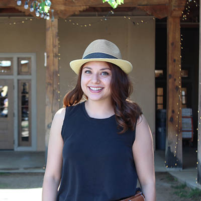 photo of ashley martinez wearing a fedora