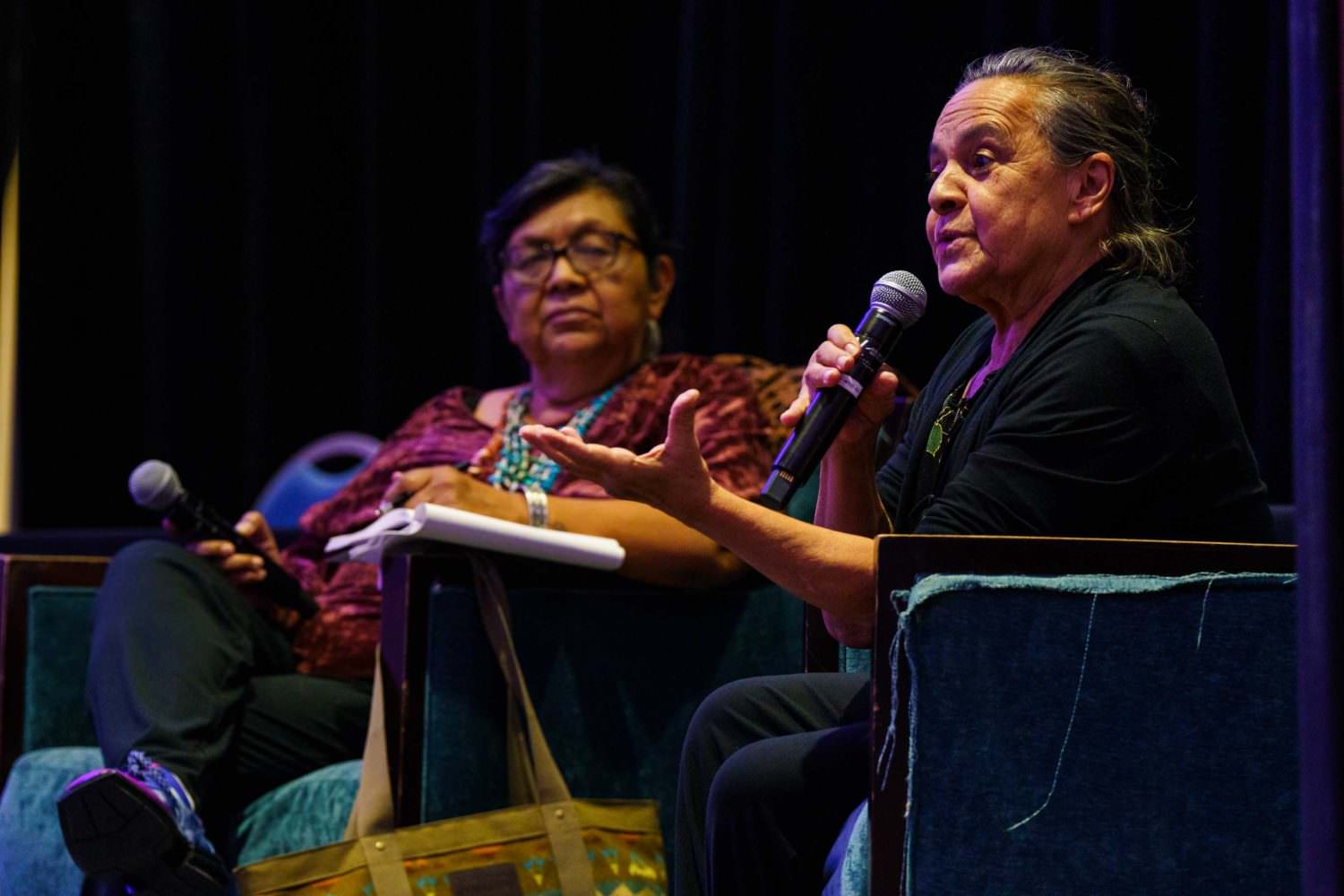 Professor of American Studies Dr. Jennifer Nez Denetdale (Diné) and NEA Heritage Fellow and UNM Professor Emerita Eva Enciñias in a conversation on a stage