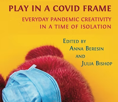Front cover of the book, "Play in a Covid Frame: Everyday Pandemic Creativity in a Time of Isolation." The cover includes a teddy bear with a surgical mask over its face.