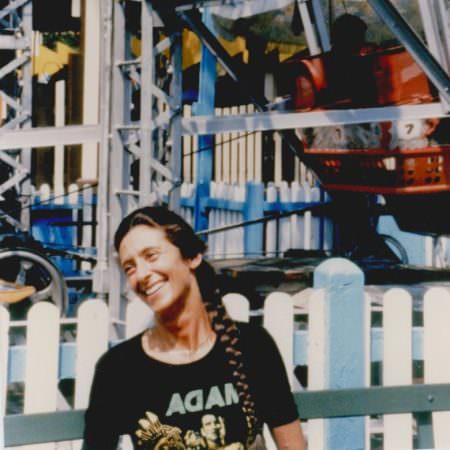 cover of album Go Around Songs, Vol. 1 by Ellen Stekert, showing a smiling woman with a background of some kind of machinery