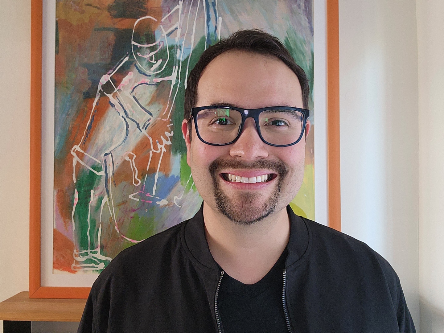 smiling male in glasses